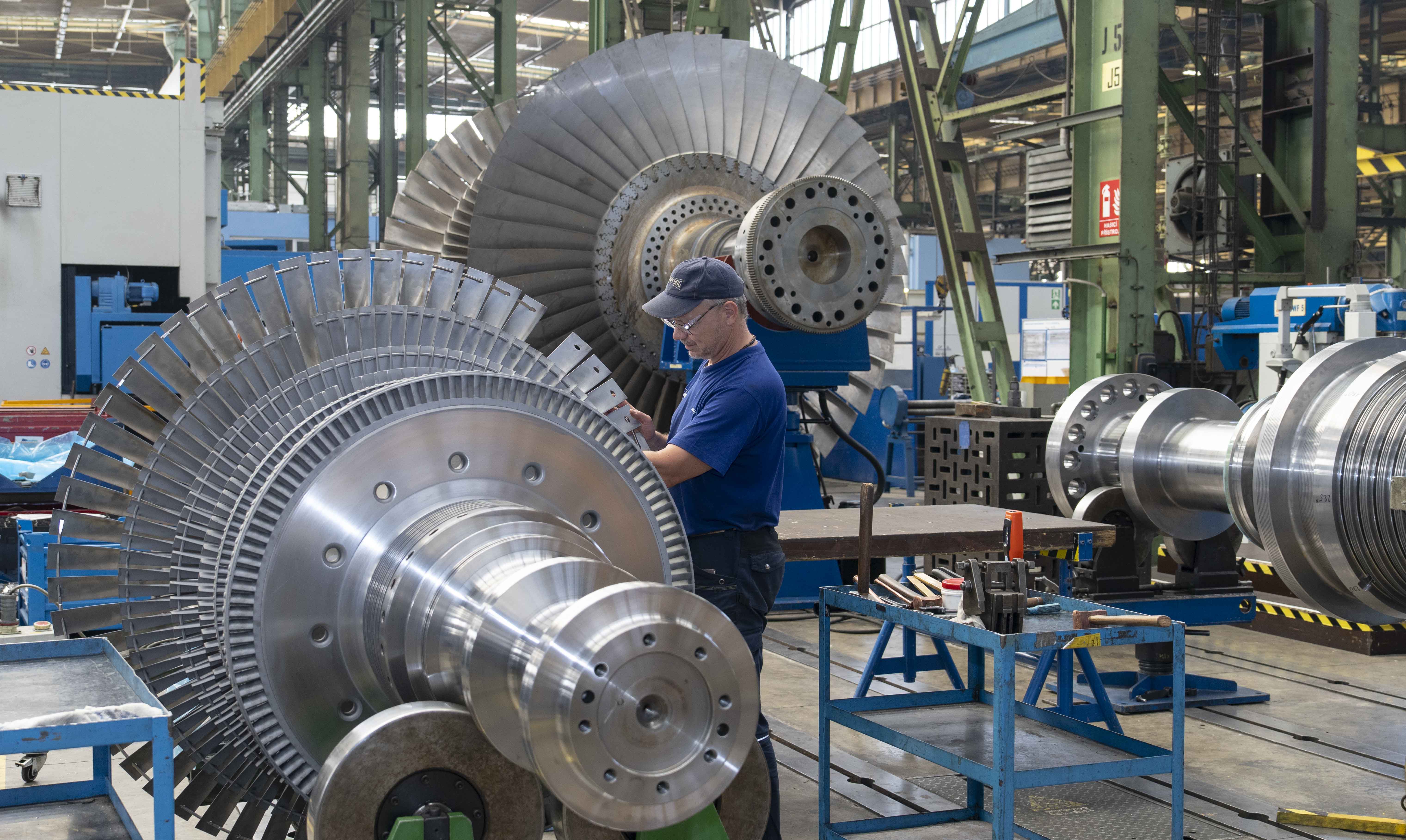 An employee looking over a steam turbine at the Doosan Skoda Power manufacturing plant in Plzen.