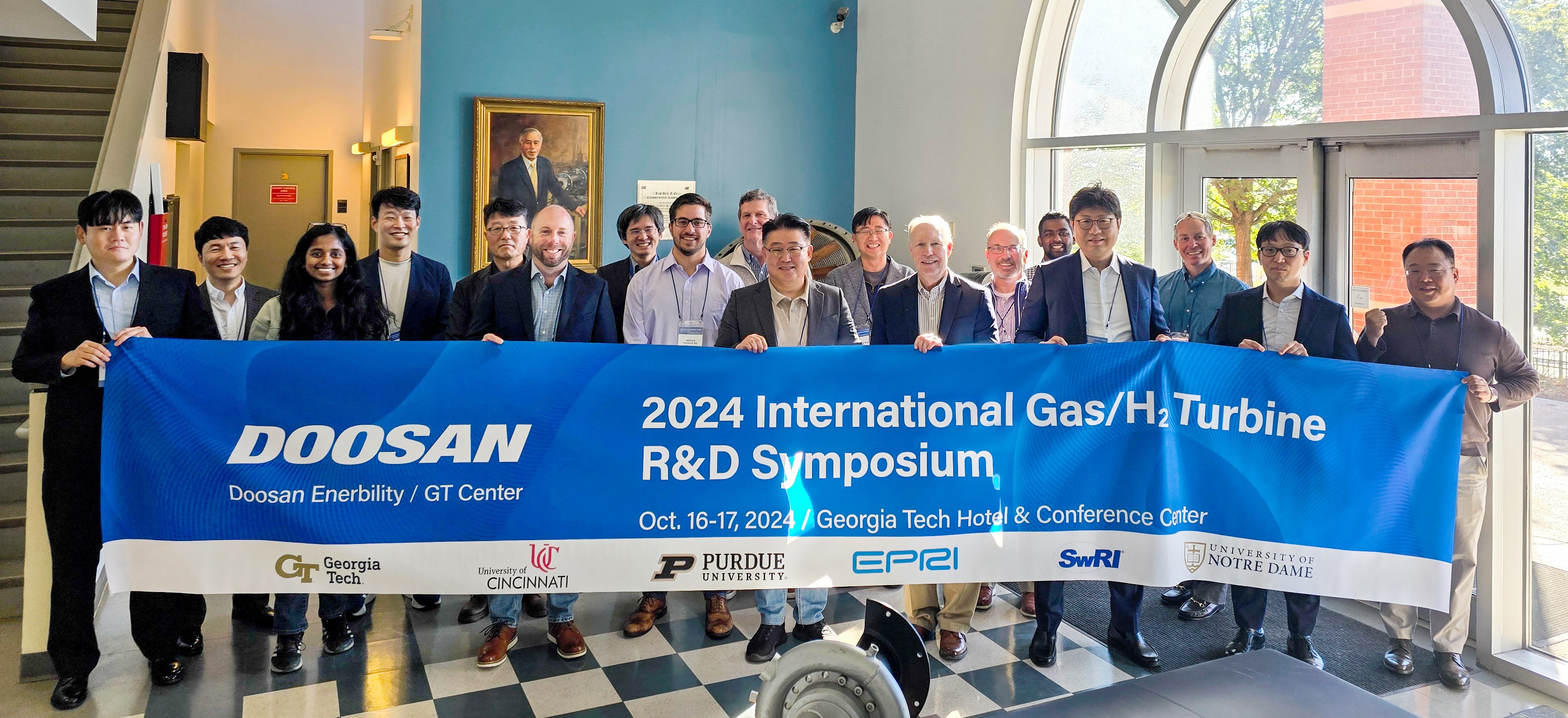 The attendees of the “International Gas/H2 Turbine R&D Symposium,” which was held at Georgia Tech on Oct. 16, pose for a group photo.