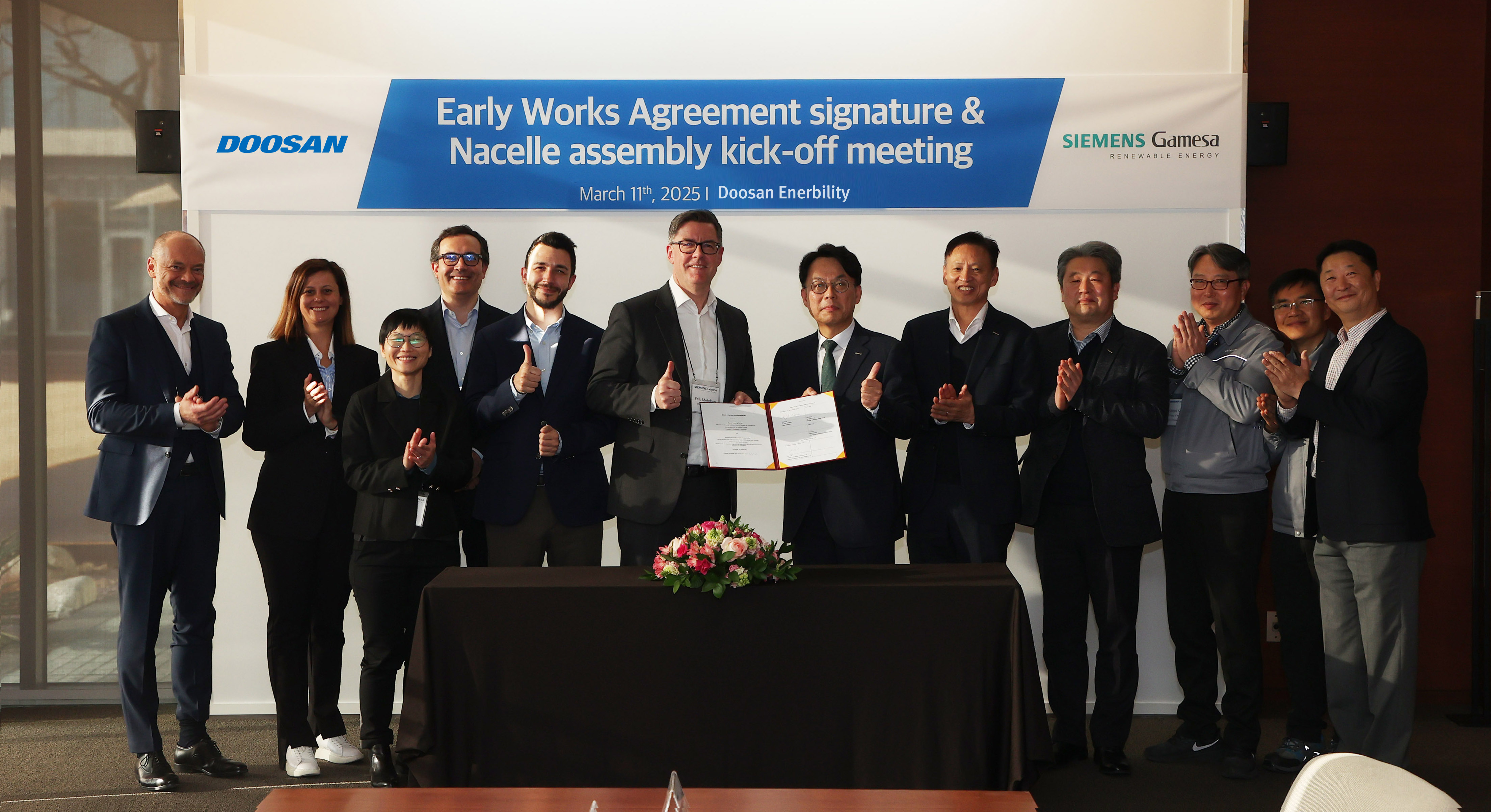 Related parties, including Falk Mehdorn, Siemens Gamesa’s COO of Nacelles (6th from the left), and Yohan Yun, Senior VP of Doosan Enerbility’s Power Services Sales & Marketing (7th from the left), attended the EWA signing ceremony held at Doosan Enerbility’s Changwon headquarters on March 11.